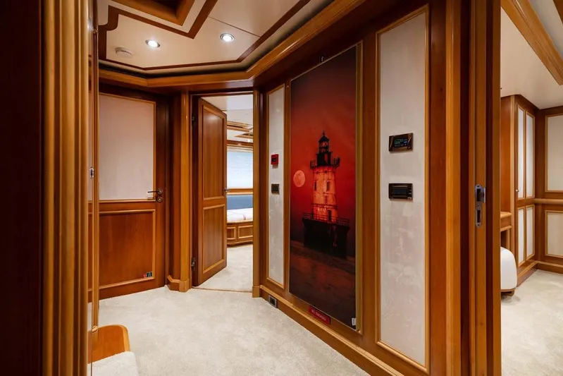 Emotion 2 Yacht Photos Pics Luxurious 2007 CRN motor yacht interior with elegant wood paneling and lighthouse artwork.