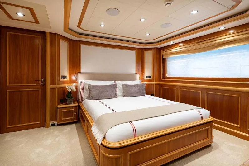 Emotion 2 Yacht Photos Pics Luxurious 2007 CRN Motor Yacht bedroom with elegant wood paneling and plush bedding.