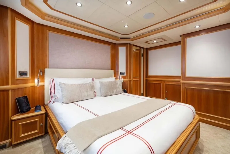Emotion 2 Yacht Photos Pics Luxurious bedroom interior on 2007 CRN Motor Yacht with elegant wood paneling.