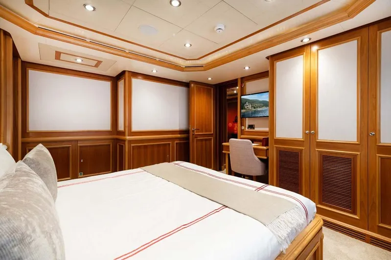 Emotion 2 Yacht Photos Pics Luxurious 2007 CRN Motor Yacht bedroom with elegant wood paneling and cozy decor.