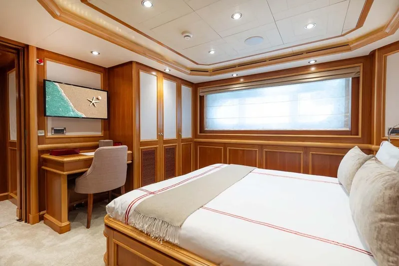 Emotion 2 Yacht Photos Pics Luxurious 2007 CRN Motor Yacht bedroom with elegant wood paneling and modern decor.