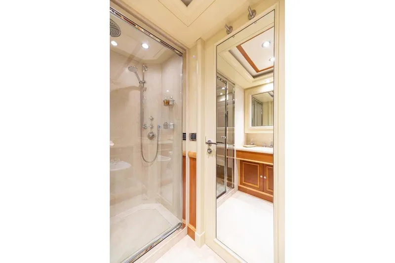 Emotion 2 Yacht Photos Pics Luxurious bathroom on 2007 CRN Motor Yacht with glass shower and elegant vanity.