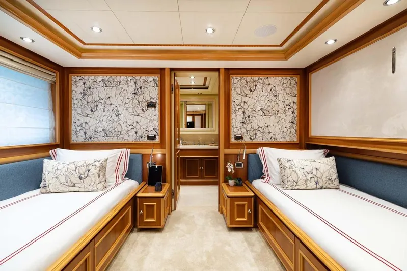 Emotion 2 Yacht Photos Pics Luxurious 2007 CRN Motor Yacht cabin with twin beds and elegant wood paneling.