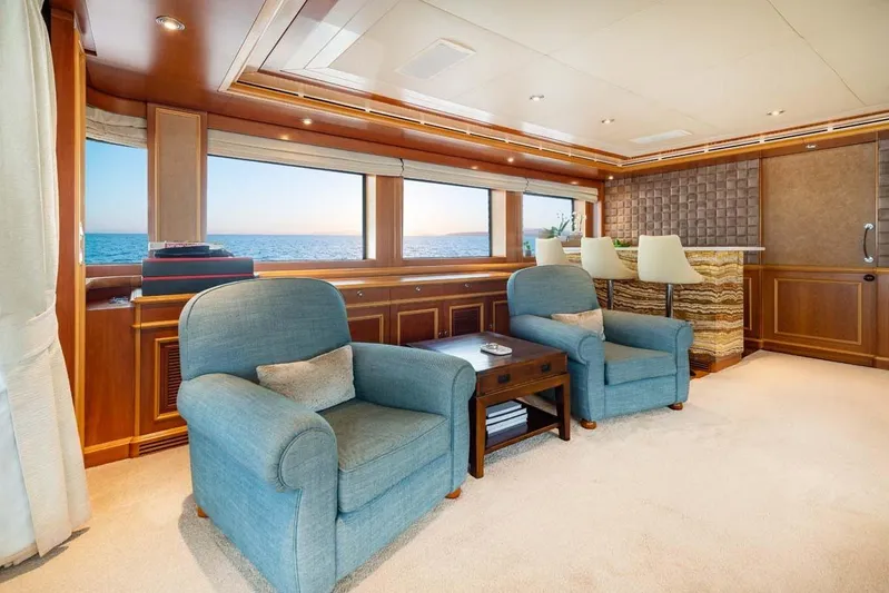 Emotion 2 Yacht Photos Pics Luxurious 2007 CRN Motor Yacht interior with ocean view, featuring elegant seating and wooden accents.