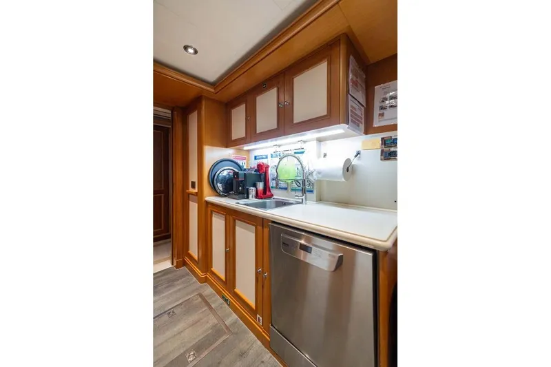 Emotion 2 Yacht Photos Pics Luxurious 2007 CRN Motor Yacht kitchen with modern appliances and elegant wood cabinetry.