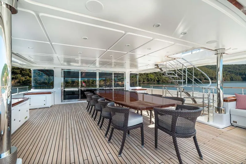 Emotion 2 Yacht Photos Pics Luxurious 2007 CRN Motor Yacht deck with elegant dining area and scenic views.