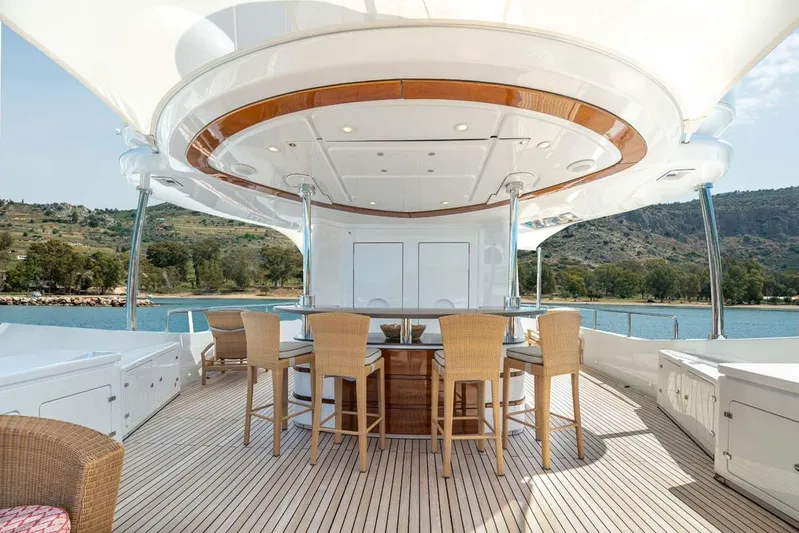 Emotion 2 Yacht Photos Pics Luxurious 2007 CRN Motor Yacht deck with elegant seating and scenic water views.