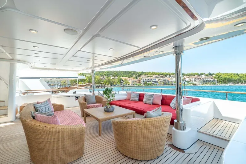 Emotion 2 Yacht Photos Pics Luxurious 2007 CRN motor yacht deck with elegant seating and scenic ocean view.