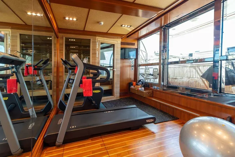 Emotion 2 Yacht Photos Pics Luxury yacht gym with treadmill, exercise ball, and large windows, CRN Motor Yacht 2007.