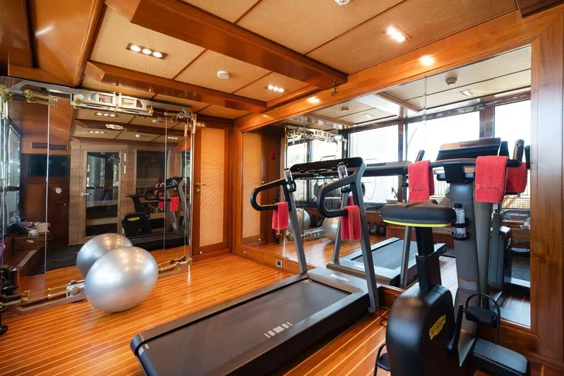 Emotion 2 Yacht Photos Pics Luxurious gym on 2007 CRN Motor Yacht with treadmill, exercise bike, and fitness balls.
