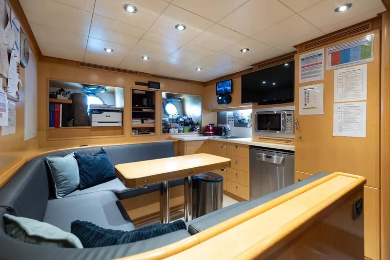 Emotion 2 Yacht Photos Pics Luxurious 2007 CRN motor yacht interior with modern kitchen and cozy seating area.