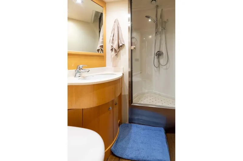 Emotion 2 Yacht Photos Pics Luxurious bathroom in 2007 CRN Motor Yacht with shower and wooden cabinetry.