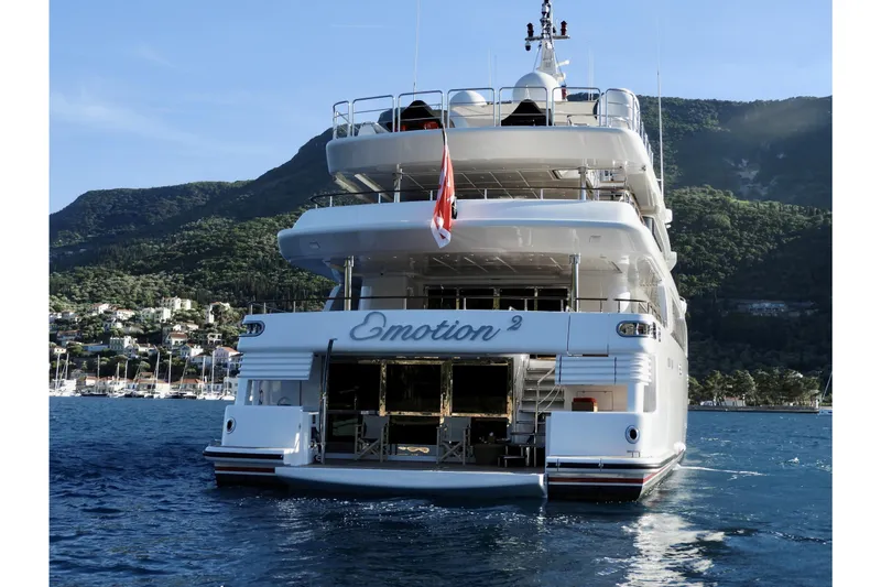 Emotion 2 Yacht Photos Pics Luxury 2007 CRN Motor Yacht on scenic water with mountainous backdrop.