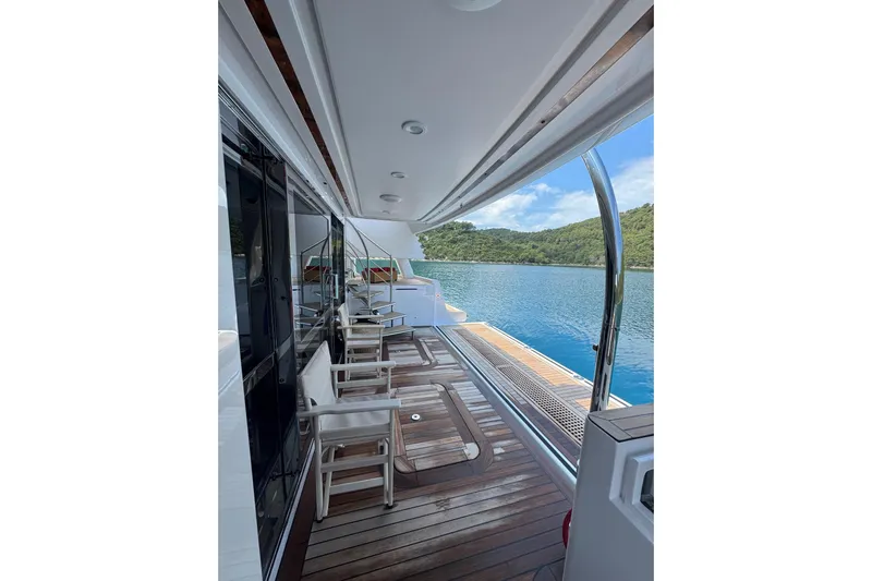 Emotion 2 Yacht Photos Pics Luxurious 2007 CRN Motor Yacht deck with scenic ocean view.