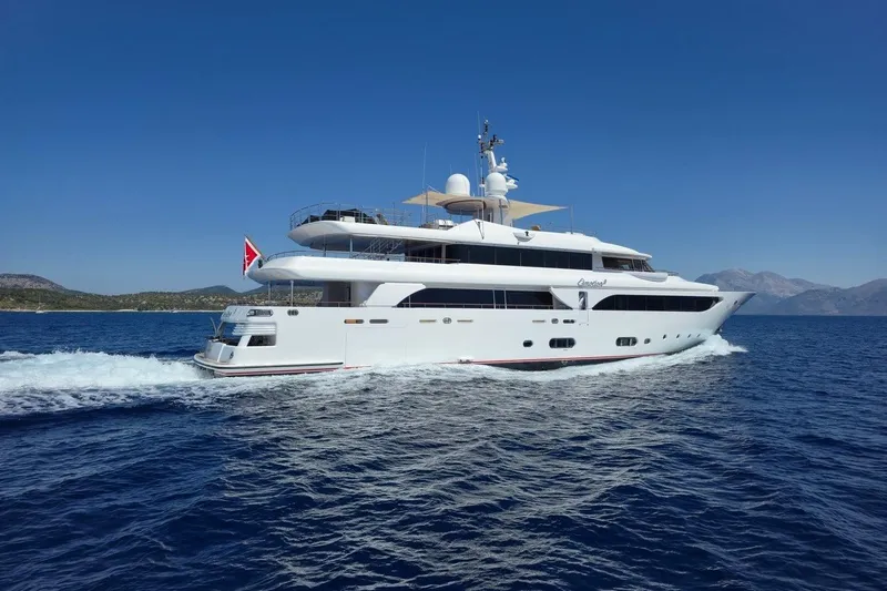 Emotion 2 Yacht Photos Pics Luxurious 2007 CRN Motor Yacht cruising on open sea under clear blue sky.