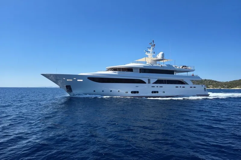 Emotion 2 Yacht Photos Pics Luxurious 2007 CRN Motor Yacht cruising on open sea under clear blue sky.