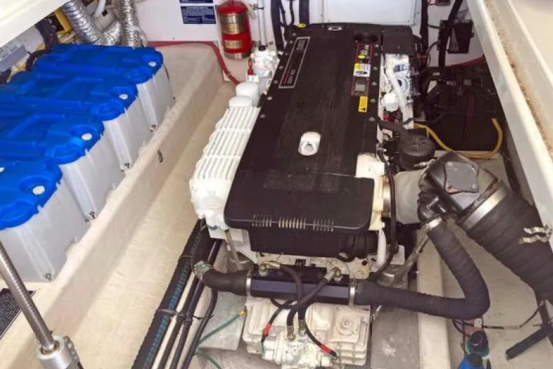 Ha Kin Yacht Photos Pics Engine room of a 2008 Back Cove 33 boat, featuring batteries and a fire extinguisher.