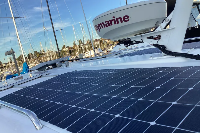 Ha Kin Yacht Photos Pics 2008 Back Cove 33 boat with solar panels and Raymarine equipment in a marina.