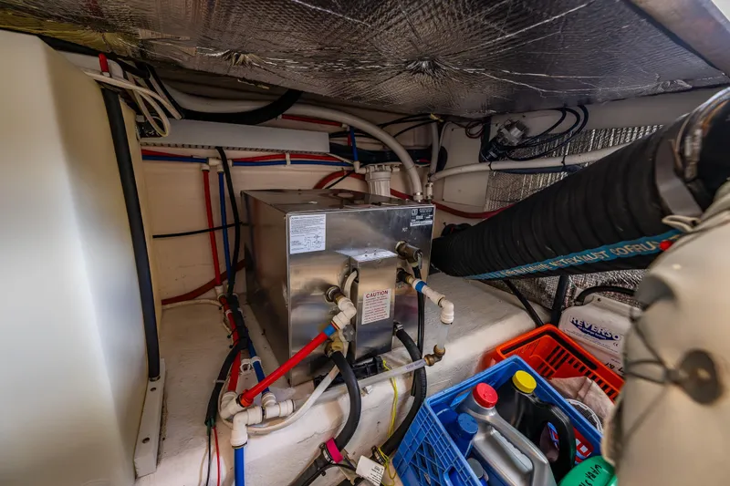 Ha Kin Yacht Photos Pics Engine room of 2008 Back Cove 33 boat with equipment and storage.