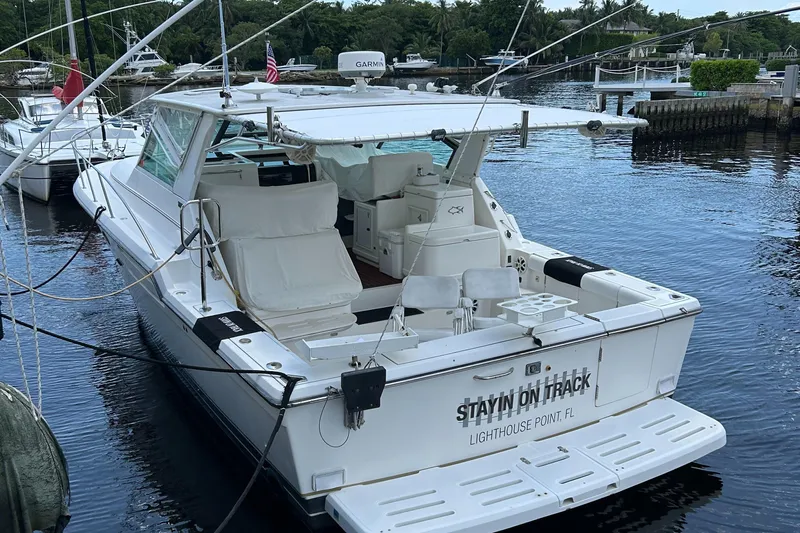  Yacht Photos Pics 2000 Tiara Yachts 3700 Open docked at marina, rear view.