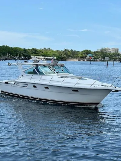  Yacht Photos Pics 2000 Tiara Yachts 3700 Open cruising on a calm, scenic waterway.