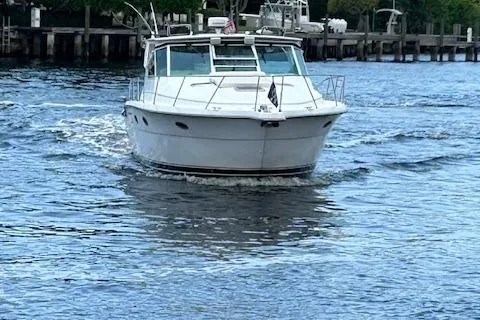  Yacht Photos Pics 2000 Tiara Yachts 3700 Open cruising on a calm waterway.