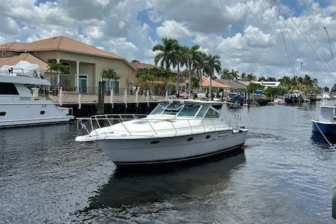  Yacht Photos Pics Tiara Yachts 3700 Open 2000 model cruising in a scenic marina.