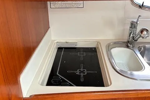  Yacht Photos Pics Tiara Yachts 3700 Open 2000 model kitchen with stove and sink.