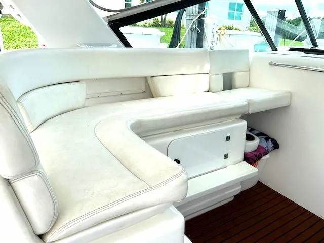  Yacht Photos Pics 2000 Tiara Yachts 3700 Open interior with white seating and wooden flooring.