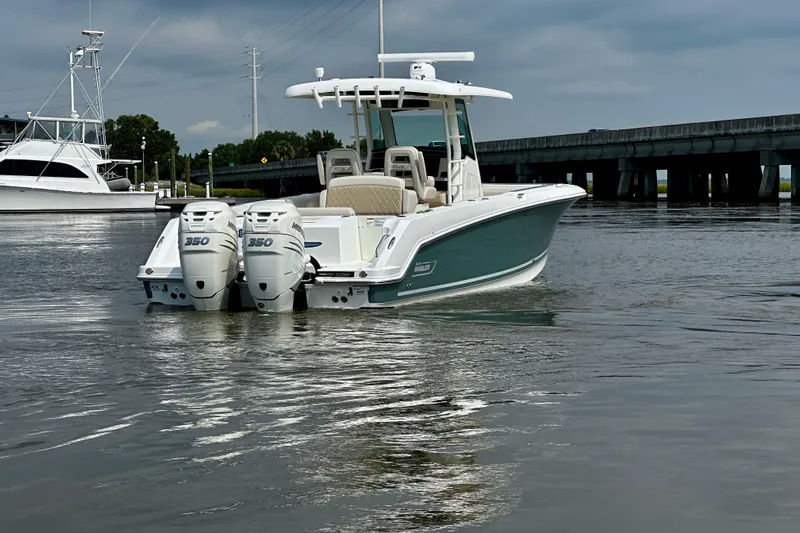 Bottoms Up Yacht Photos Pics 2019 Boston Whaler 330 Outrage boat with twin 350 engines on calm water.