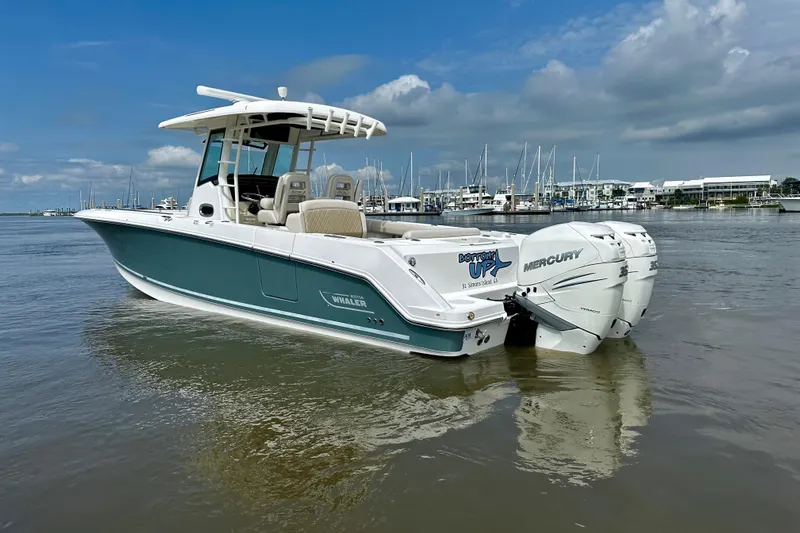 Bottoms Up Yacht Photos Pics 2019 Boston Whaler 330 Outrage boat with twin Mercury engines on calm water.