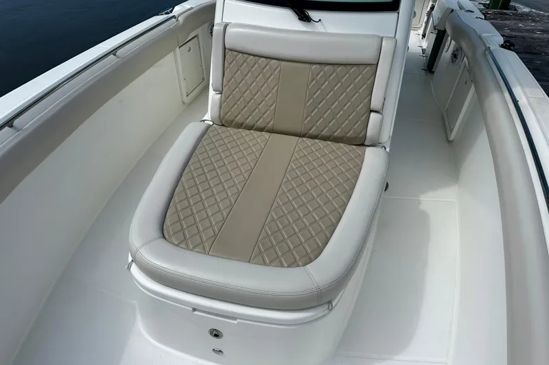 Bottoms Up Yacht Photos Pics 2019 Boston Whaler 330 Outrage boat with cushioned seating and elegant design.