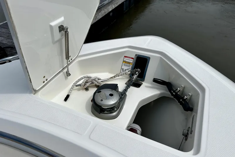 Bottoms Up Yacht Photos Pics 2019 Boston Whaler 330 Outrage anchor compartment with rope and winch.