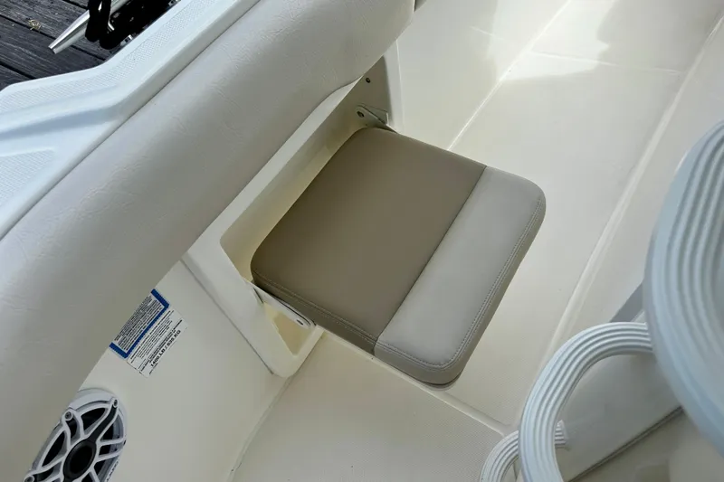 Bottoms Up Yacht Photos Pics 2019 Boston Whaler 330 Outrage boat seat detail with beige cushion and speaker.