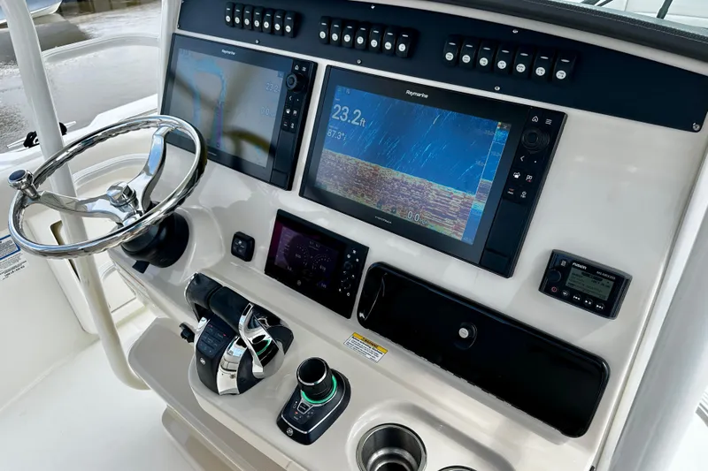 Bottoms Up Yacht Photos Pics 2019 Boston Whaler 330 Outrage helm with advanced navigation and control systems.