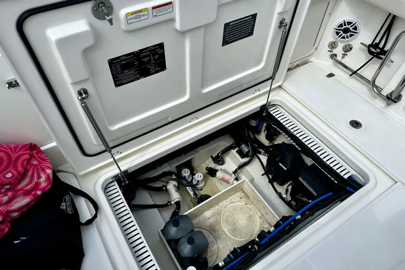 Bottoms Up Yacht Photos Pics 2019 Boston Whaler 330 Outrage boat storage compartment with equipment and accessories.