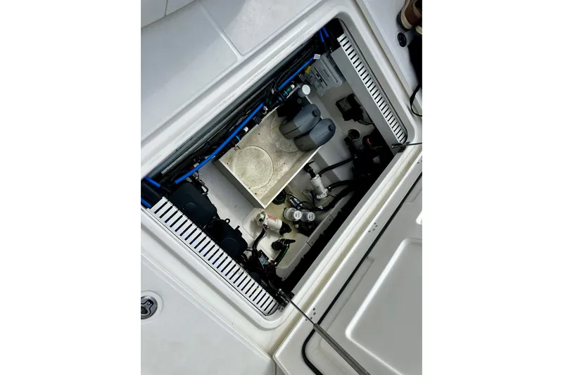 Bottoms Up Yacht Photos Pics 2019 Boston Whaler 330 Outrage engine compartment with visible components and wiring.