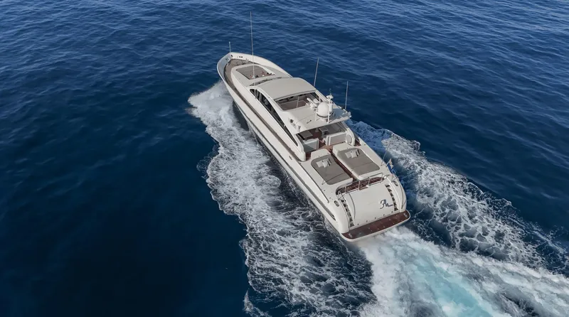  Yacht Photos Pics Luxury Leopard 27 yacht cruising on open sea, 1999 model.