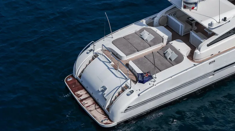  Yacht Photos Pics Luxury Leopard 27 yacht from 1999, featuring spacious sunbathing area on open water.