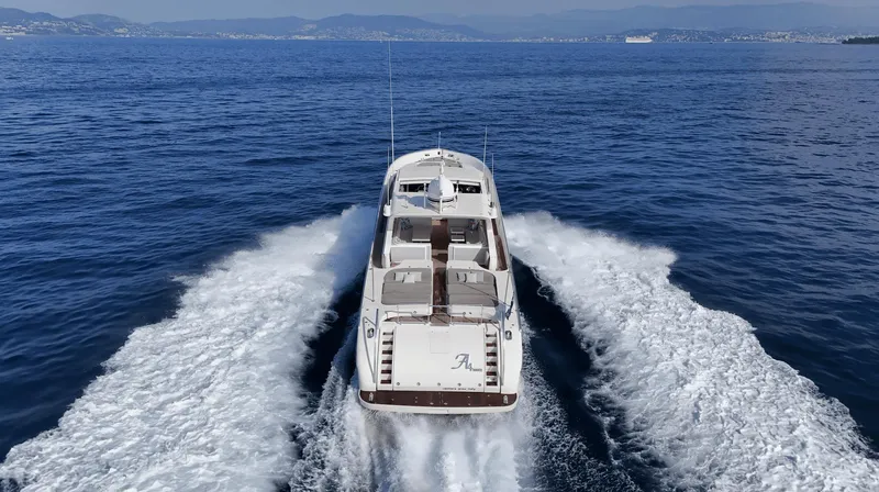  Yacht Photos Pics Luxury Leopard 27 yacht cruising on open sea, 1999 model, aerial view.