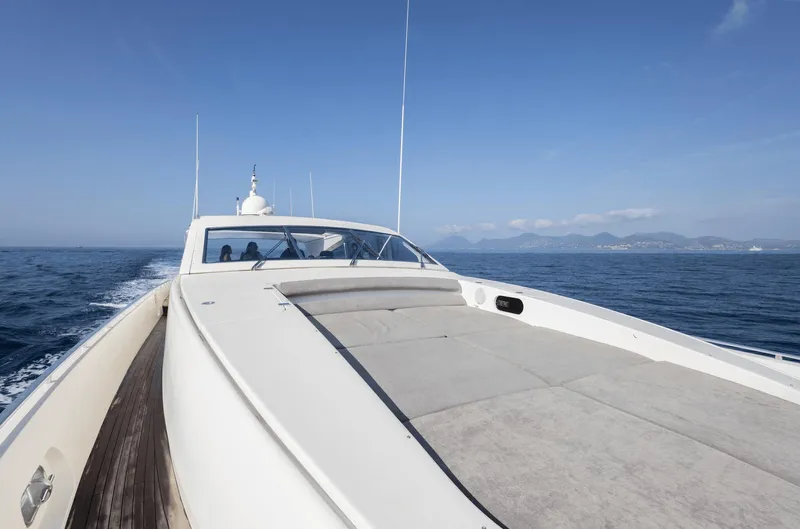  Yacht Photos Pics Luxury Leopard 27 yacht cruising on open sea, clear blue sky, 1999 model.