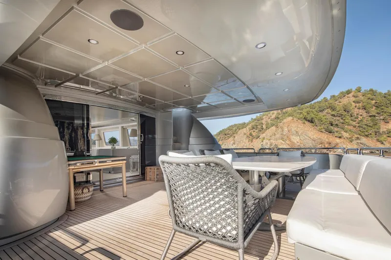  Yacht Photos Pics Luxurious 2009 Canados 110 yacht deck with elegant seating and scenic ocean view.