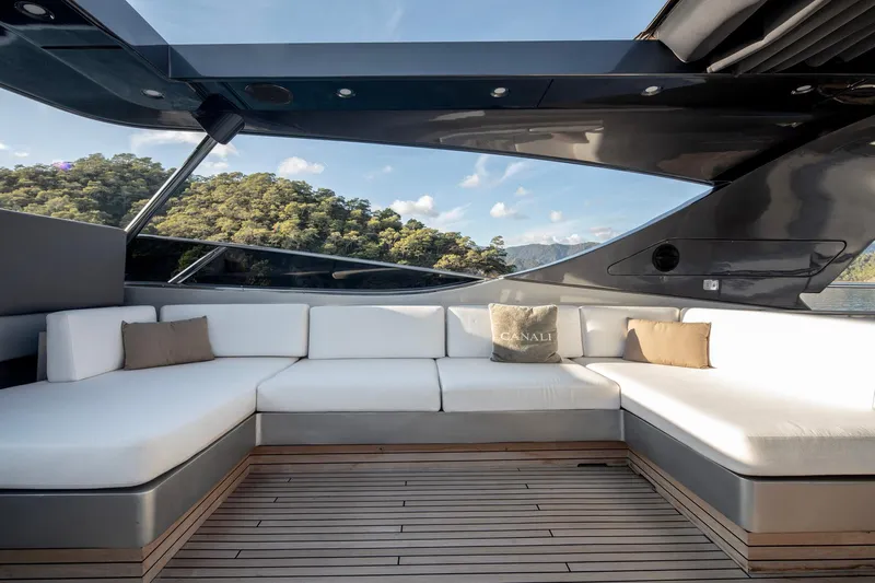  Yacht Photos Pics Luxurious Canados 110 yacht deck with white seating, wooden flooring, and scenic view, 2009 model.