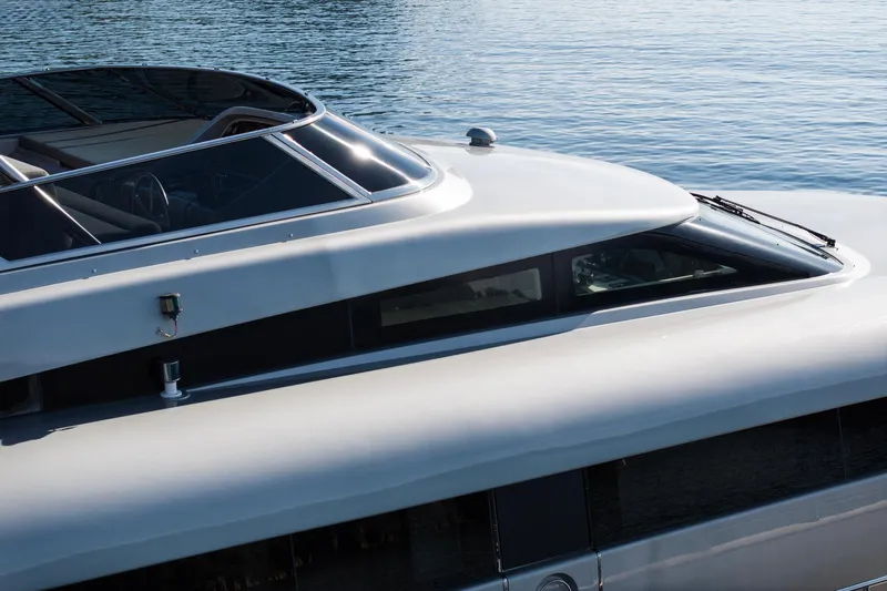  Yacht Photos Pics Luxury Canados 110 yacht, 2009 model, sleek design on calm water.