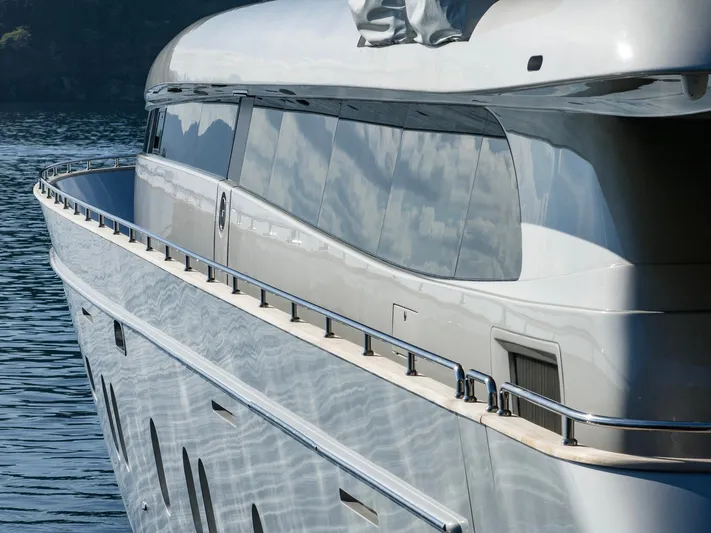  Yacht Photos Pics Luxurious 2009 Canados 110 yacht with sleek design and reflective windows on calm water.