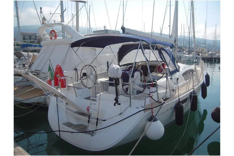  Yacht Photos Pics 2010 Jeanneau Sun Odyssey 42 DS sailboat docked in a marina, featuring a sleek design.