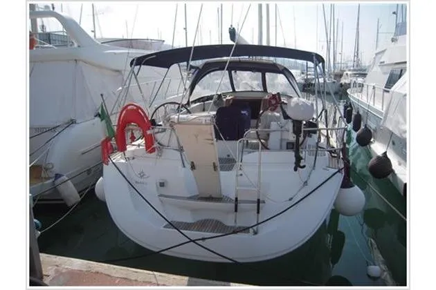  Yacht Photos Pics 2010 Jeanneau Sun Odyssey 42 DS sailboat docked in marina, rear view.