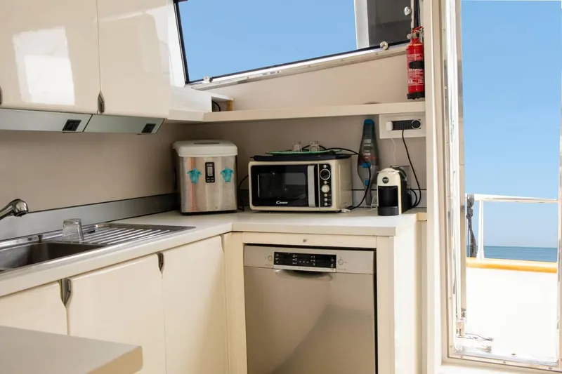 Kinglass VI Yacht Photos Pics Kitchen area of 1999 Sanlorenzo SL82 yacht with appliances and ocean view.