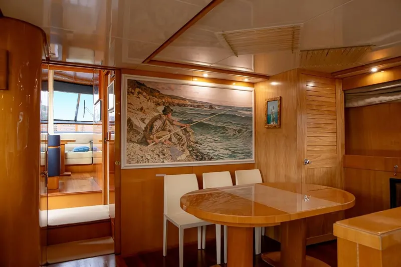 Kinglass VI Yacht Photos Pics Luxurious interior of 1999 Sanlorenzo SL82 yacht with elegant wood finishes and artwork.