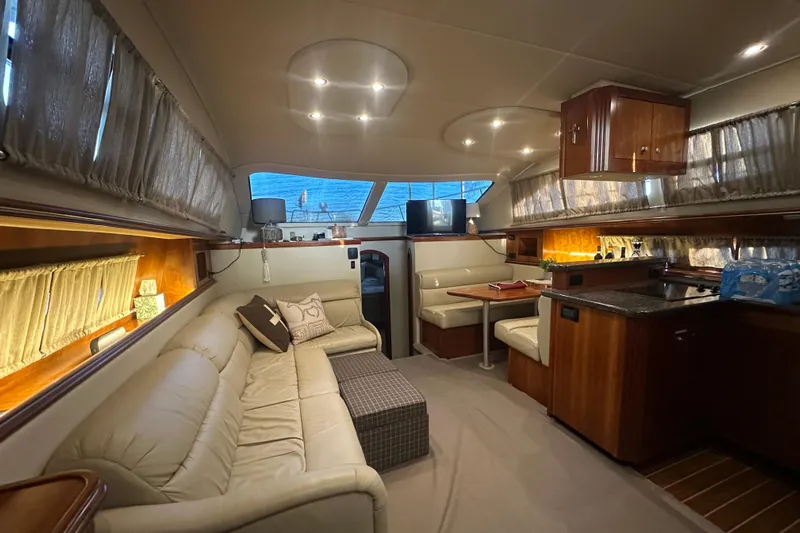 Sassy II Yacht Photos Pics Luxurious interior of 2008 Cruisers Yachts 415 Express Motoryacht with elegant seating and dining area.